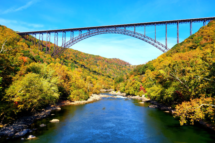 New River Gorge Bridge with colorful fall foliage in West Virginia’s New River Gorge National Park